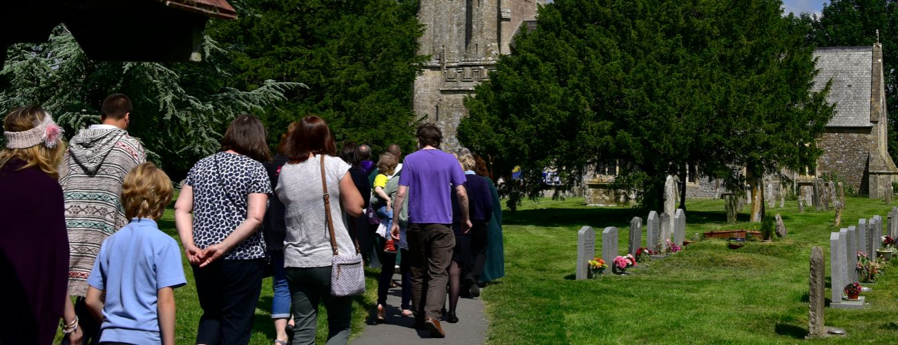 Walking group heading away from the camera into St James church